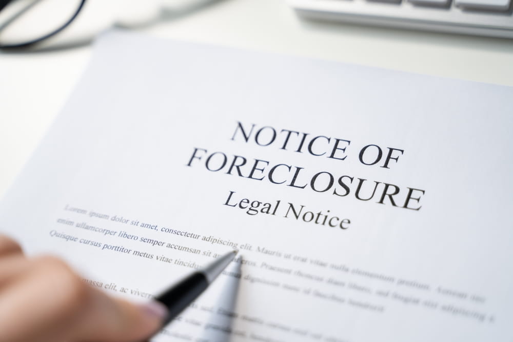 notice of foreclosure legal document being reviewed by homeowner